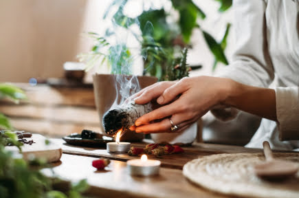 hands-burning-white-sage-ancient